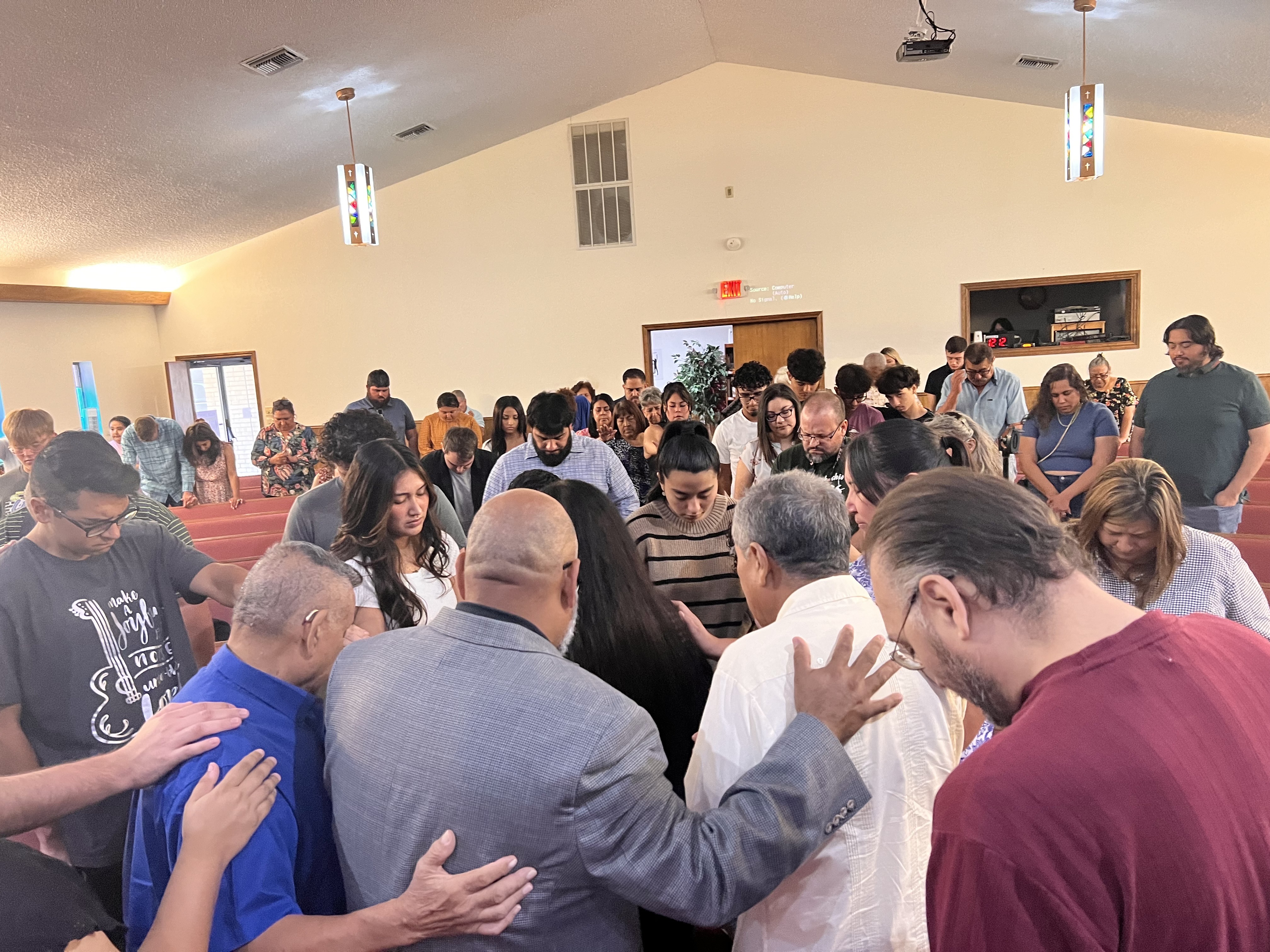 Members of Primera Baptist gathered in prayer and Bible study